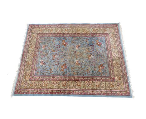 Romanian pictorial woollen carpet, sky blue field dispersed with figures hunting on horseback, within a fawn border detailed 