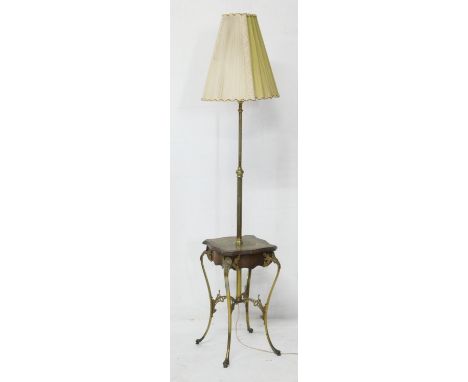 French walnut and brass extending standard lamp table, circa 1900-20, the ratchet column over a shaped square table with bras