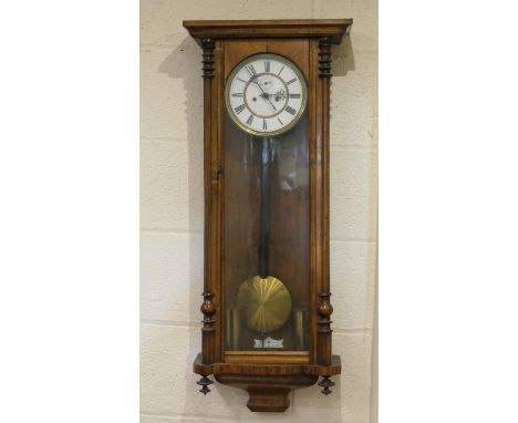 Late Victorian walnut Vienna wall clock, circa 1890, white dial with Roman numerals, subsidiary seconds, twin weight movement
