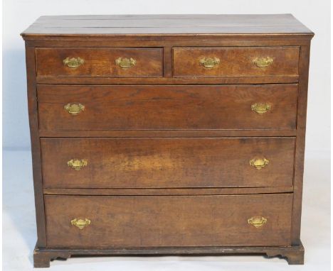 Provincial oak chest of drawers, 19th Century, having two short and three long graduating drawers with later brass handles, r