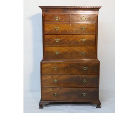 George III mahogany chest on chest, circa 1800, having a dentil and cavetto moulded cornice over two short and three long dra