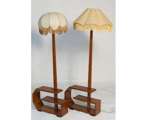 Three French Art Deco walnut standard lamp book tables, two with shades, height 46cm, width 65cm, depth 19cm 