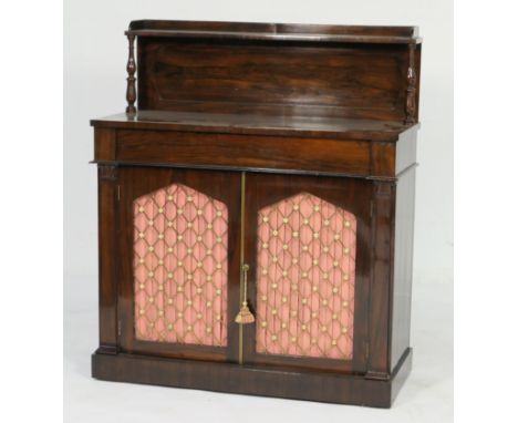 Regency rosewood chiffonier, having a recessed panel back with a single shelf and three-quarter gallery supported on turned c