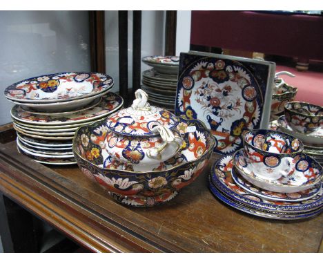 Three Ashworth Ironstone Plates, decorated in the Imari palette with urns of flowers within a panelled border of birds and fl