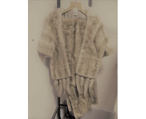 A Light Beige Mink Stole, with collar and cuffs giving the effect of a bolero jacket, each end with four detachable tail tass