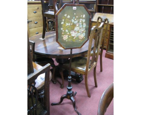 A XIX Century Pole Screeen, with a framed woolwork tapestry, the pole with acorn finial, on cabriole legs, pad feet.