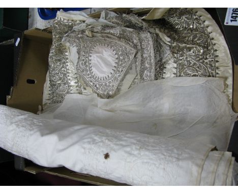 A Cream Silk Satin Panel, embroidered with silver metal thread and sequins, 177 x 57cm; seventeen small square mats similar.