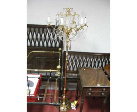 A Heavy Brass Standard lamp, with faceted lustre drops to six branches, on circular base, and spare bulbs. 