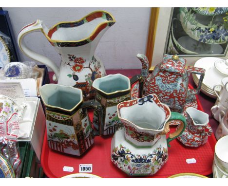 Ashworth's Ironstone Teapot, decorated with Chinese mythologiocal beasts on iron red ground, a similar jug and plate, Mason's