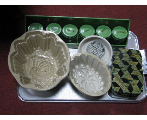 A Garrison Spice Rack, Holding six jars and confectionary tins, jelly moulds, Kirkham advertising dentist dish.