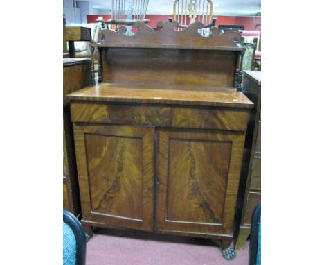 A XIX Century Mahogany Chiffonier, with a shaped back, single shelf, supported turned supports, base with two small drawers, 