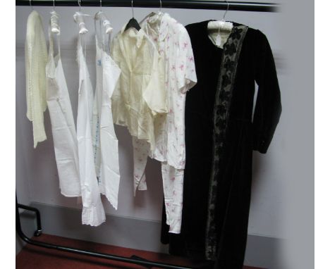 An Early XX Century Black Velvet Dress, with gathered waist and offset cntral black lace panel; a cream silk blouse, knitted 