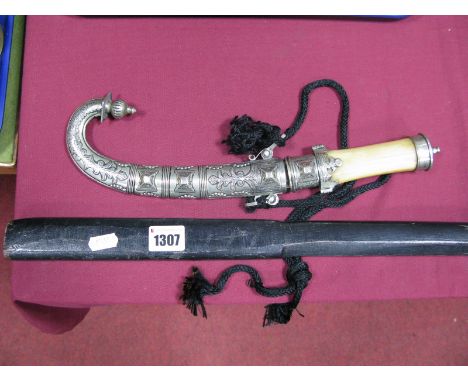 An Ebonised Japanese Bokken Club, with scratch work decoration; together with an Arabic dagger with a horn handle, white meta