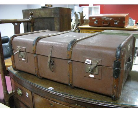 A Vintage XX Century Brown Trunk, with wooden batons, leather handles, initials V.S. on the top.