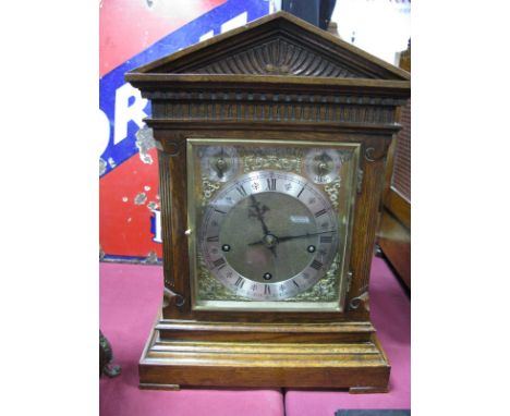 An Early XX Century Oak Westminster Chime Mantel Clock, pediment with dentil frieze, silver chapter ring with Roman numerals,