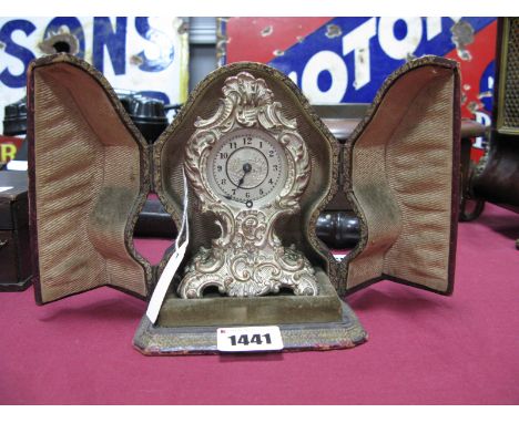 A Late XIX Century Silvered Metal Mantel Clock, of Rococco form, cast with elaborate scrolling foliate decoration, the floral