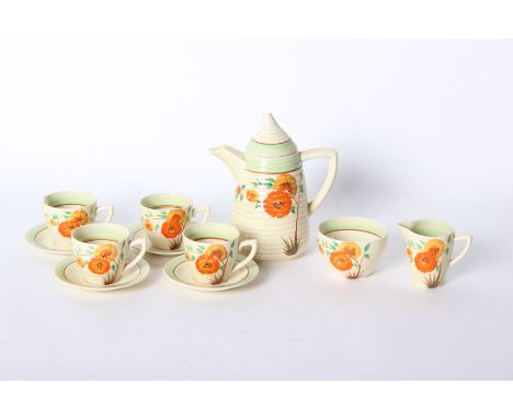 A Clarice Cliffe tea set to include teapot, milk jug and cups and saucers 