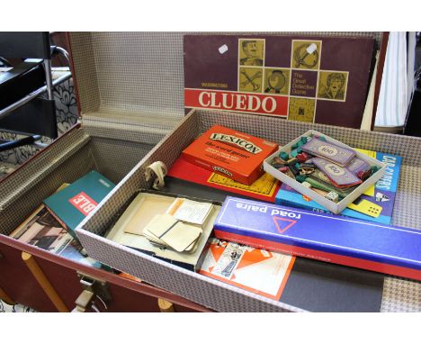 Two leather bound chests containing a large quantity of vintage toys and games.