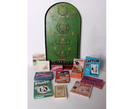 A collection of vintage toys and games to include a bagatelle football game.