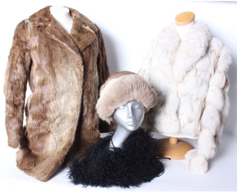 A continental mid brown fur coat; a white fur jacket with leopard print lining, a fur hat and a modern black collar