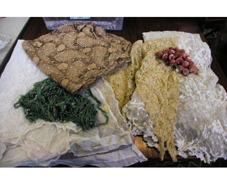 An early 20th Century cream lace shawl; a length of 1920s coffee coloured dress lace, a quantity of green sequin and bead tri