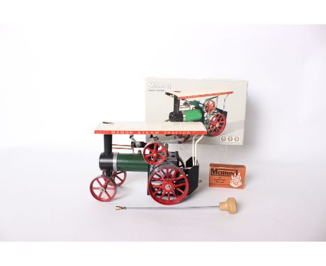 A Mamod steam tractor TE1A, with steering rod and solid fuel tablets, comes with original box.