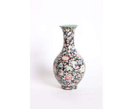 A Chinese Tao Kuang baluster shaped vase, polychrome floral enamel decoration on black ground, gilt top, with blue calligraph