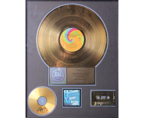 Elton John - an autographed and certified RIAA Sales Award commemorative gold disc, CD and tape display presented to Elton Jo