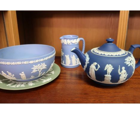 Five Wedgwood jasper ware pieces - teapot, bowl, jug and trinket pot in blue, with a plate in sage, together  with an art dec