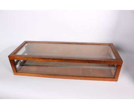 A mahogany framed table-top display cabinet (18cm x 30cm). Glazed top and three sides, with internal glass shelf.