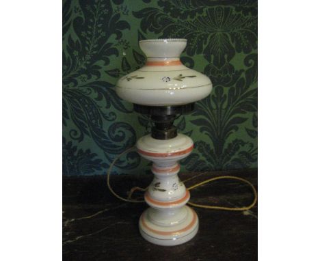 THIS LOT IS PART OF THE CONSIGNMENT FROM BODELWYDDAN CASTLE A CIRCULAR BASE &amp; COLUMN MILK GLASS ELECTRIFIED OIL LAMP with