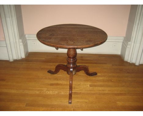 19TH CENTURY CIRCULAR OAK TRIPOD TABLE having centre turned pedestal on pad supports, 85cms Diameter