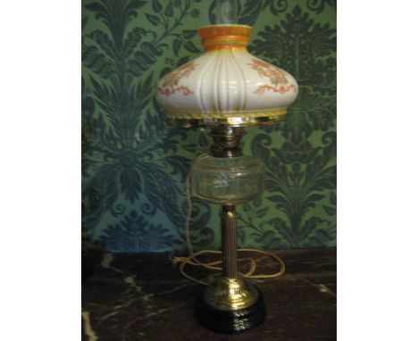 THIS LOT IS PART OF THE CONSIGNMENT FROM BODELWYDDAN CASTLE A CIRCULAR BASED BRASS CORINTHIAN COLUMN electrified oil lamp wit