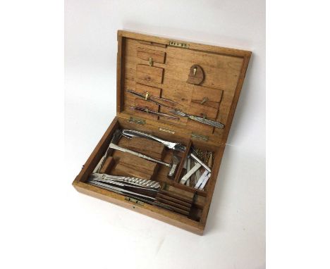 An antique surgeon's set/postmortem set of tools, with broad arrow marks, with tools including a bone/skull cracker hammer, b
