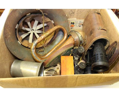 Collection of WWII memorabilia including binoculars, helmet, bugle, etc