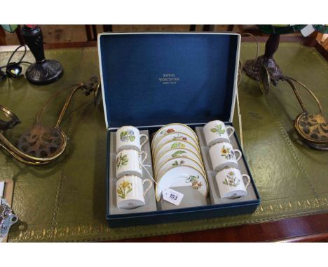 Royal Worcester boxed coffee cans and saucers, each with individual floral specimen painting