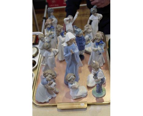 Good collection of seventeen Lladro Nao figures, mostly of children, some with pets