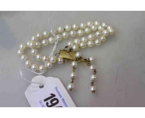 Cultured pearl and gold bracelet and a pair of earrings