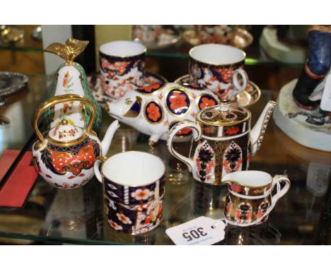 Royal Crown Derby: Pair of cups and saucers, miniature coffee pot and cream jug, coffee can, miniature teapot and pig paperwe