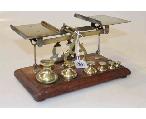 Set of John Heath, Birmingham, brass and beech scales, with eight weights, base 28cm wide