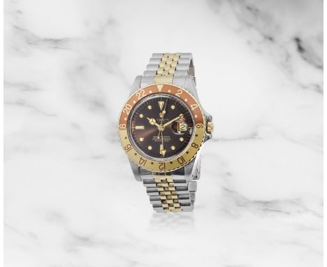 Rolex. Montre bracelet en or jaune 18K (750) et acier avec date, 2nd fuseau horaire et cadran 'nipple' mouvement automatiqueR