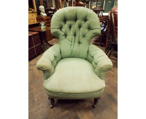 A Victorian green upholstered button back elbow chair 