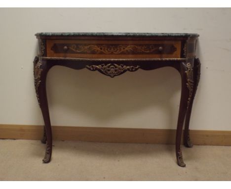 A French inlaid Kingwood serpentine front console table with gilt decorations standing on cabriole legs with green marble top