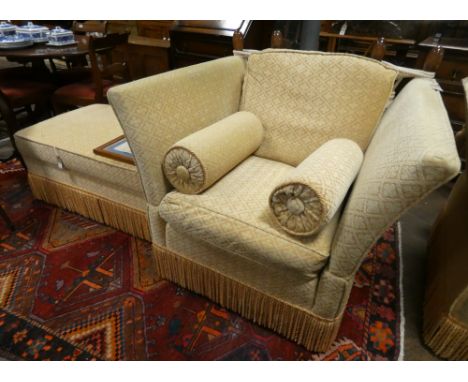 A Knoll gold patterned upholstered easy chair with loose cushions and a matching stool or pouffe