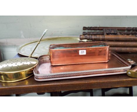 A circular brass tray table with folding stand, plated tray, copper plant trough, chestnut roaster and a poker 