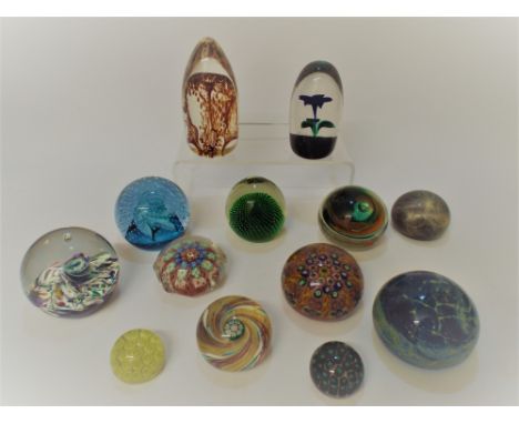 A collection of glass paperweights to include Millefiore, Caithness, Strathearn and Perthshire 