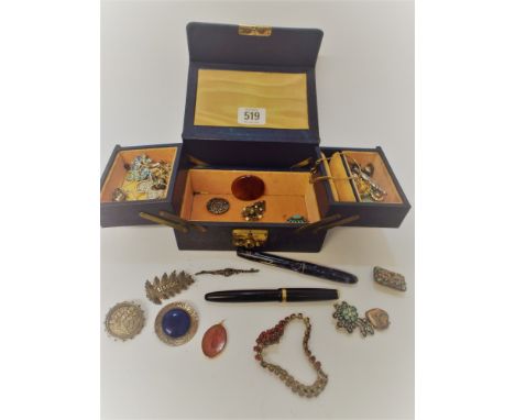 A leather jewellery box and contents to include silver Victorian brooches, oval intaglio hardstone, vintage fountain pens etc