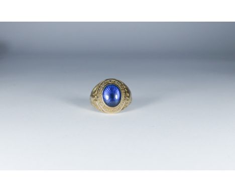 American 10k gold graduation ring, set with an oval blue stone, ring size K, 5.4 grams.