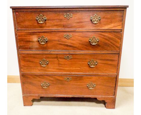 A Georgian mahogany chest of four long drawers with brass fall handles standing on bracket feet, 39.5" wide