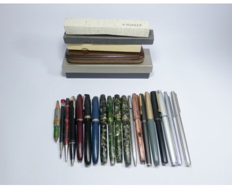 A large quantity of vintage fountain pens, to include Conway Stewart, Waterman, Parker with 14k gold nibs and a silver Sheaff